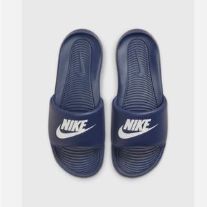 Navy Nike slides.